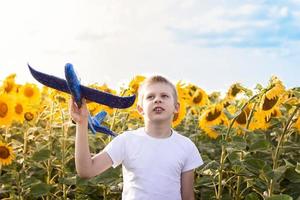 Boy with airplane sky background photo