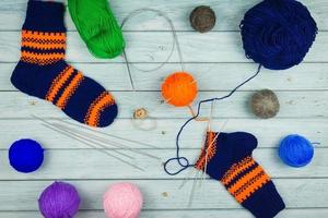 Knitting on blue background photo