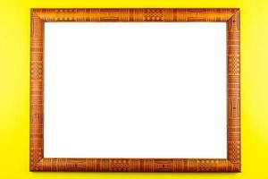 Wooden frame yellow background photo