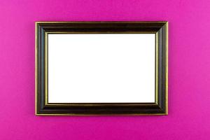 Wooden frame pink background photo