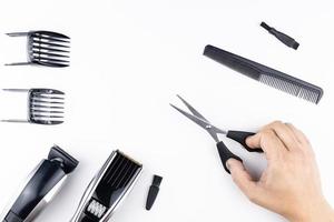 scissors and combs on white photo