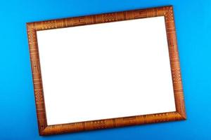 Wooden frame blue background photo