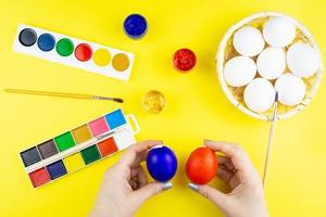 Girl paints eggs photo