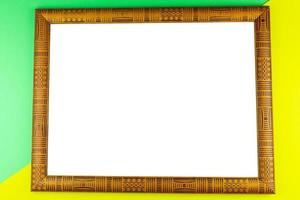 Wooden frame yellow background photo