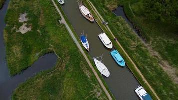 Aerial view of yachts and boats moored in Norfolk broads video