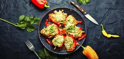 Roasted bell peppers stuffed with rice and meat photo