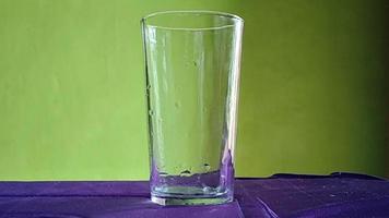 Pouring water into a glass video