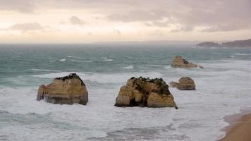 HD stock video of a stormy sea, with large waves, at sunset