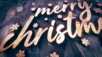 Merry Christmas gold text  on dark wood animation video