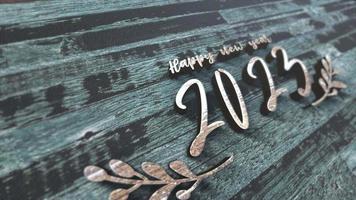2023 Happy New Year text on  wood animation video