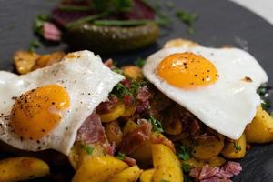 Farmers Breakfast with ham eggs and fried potatoes photo