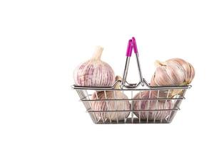 Garlic, a head of garlic in a shopping cart on a white background. photo