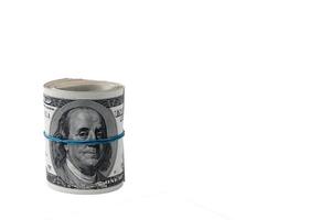 US hundred dollar bills are rolled up on a transparent background. PNG. photo