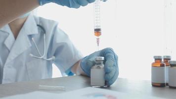 Medical Research Laboratory Portrait of a Female Scientist Wearing Face Mask Using Micro Pipette for Analysis. Advanced Scientific Lab for Medicine, Biotechnology Development. Close-up Shot video