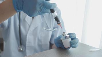 Medical Research Laboratory Portrait of a Female Scientist Wearing Face Mask Using Micro Pipette for Analysis. Advanced Scientific Lab for Medicine, Biotechnology Development. Close-up Shot video