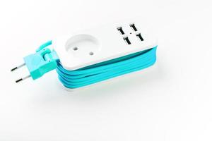 Extension Socket with USB Port on white background for charging phones and electronic devices, blue power cord. photo