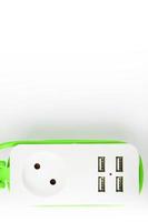 Extension USB Power Strip Green power cord for charging gadgets and electronic devices. photo