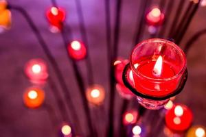 Close up Aroma Purple candles colorful in blur background for background and texture photo