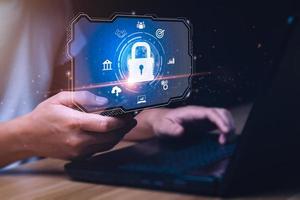 cybersecurity security concept Protecting digital assets from hacks, attacks, implementing strategies. Businessman preventing mobile or computer data hacking. online scammers, denial of service DDoS photo