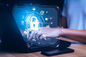 Concept cybersecurity and, of data, network. Data protection programmer with laptop computer with padlock icon. customer confidential information. hacker digital crime, online scammers photo