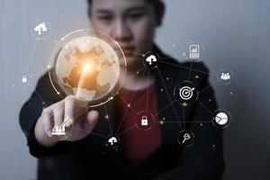 business woman touching world icon global network connection concept Big data analytics and global business. customer service management, cloud computing, Encryption and data protection photo