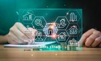 real estate concept, Businessman or home broker with virtual hologram property value on laptop screen. Searching and investing in real estate buy a new home for the family, home search, property tax photo