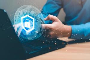 Technology concept with cyber security internet and networking, man holding smartphone with shield icon virtual with lock symbol with network security photo