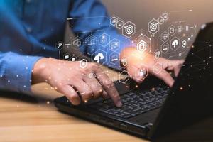 Internet Security and Cyber Network Concepts. Businessman working with laptop computer with padlock icon. data protection and personal information. Hackers' digital crimes photo