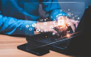 Concept cybersecurity and, of data, network. Data protection programmer with laptop computer with padlock icon. customer confidential information. hacker digital crime, online scammers photo