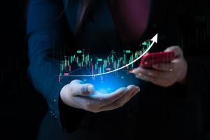 Business man or trader showing a virtual trading chart with arrow. planning and strategy, Stock market, Business growth, progress or success concept. financial graph bar candlestick photo