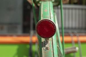 Signal light on bike. Reflector for road. photo