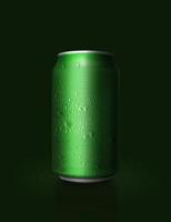 green aluminum can with water droplets on dark green background photo