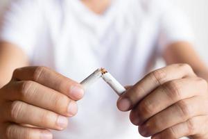 Men quit smoking for good health. photo