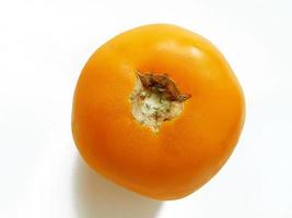 yellow fresh tomato on white background photo