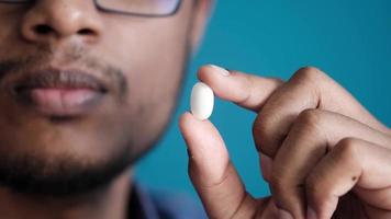 Man shows white pill video