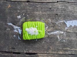 putu cake. typical street food in Indonesia with toppings from grated coconut photo