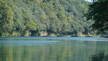 The beautiful countryside view with the clear river and mountains as background in the countryside of the China photo