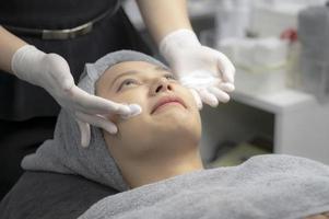 Young women facials from beauty experts. photo