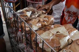 Bread crumb are in plastic bag for feeding fish in temple, Thailand. photo