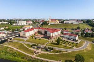 aerial panoramic view from great height on red roofs of historical center of old big city photo