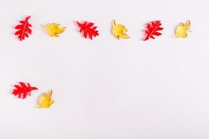 Glass autumn leaves on a pink background. Autumn decorative card photo