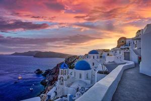 Europe summer destination. Traveling concept, sunset scenic famous landscape of Santorini island, Oia, Greece. Caldera view, colorful clouds, dream cityscape. Vacation panorama, amazing outdoor scenic photo