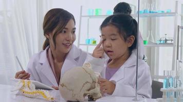 Asian schoolgirls are studying science and technology in a lab. Teachers teach science to students for learning process skills. video