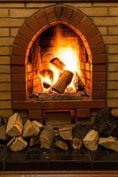 wood and fire in fireplace photo