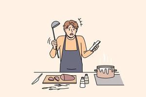 cocinar y preparar el concepto de comida. joven confundido en delantal de pie tratando de cocinar sopa hirviendo y sosteniendo un teléfono inteligente con receta en la mano ilustración vectorial vector