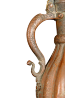 A close up of a handle of an antique copper jug with artistic chasing and engraving png