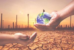 environmental protection concept The world for the future. globe in hand passed to the other