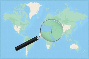 Map of the world with a magnifying glass on a map of Israel. vector