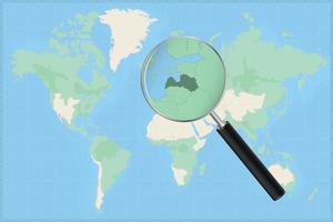 Map of the world with a magnifying glass on a map of Latvia. vector