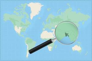 Map of the world with a magnifying glass on a map of Bangladesh. vector